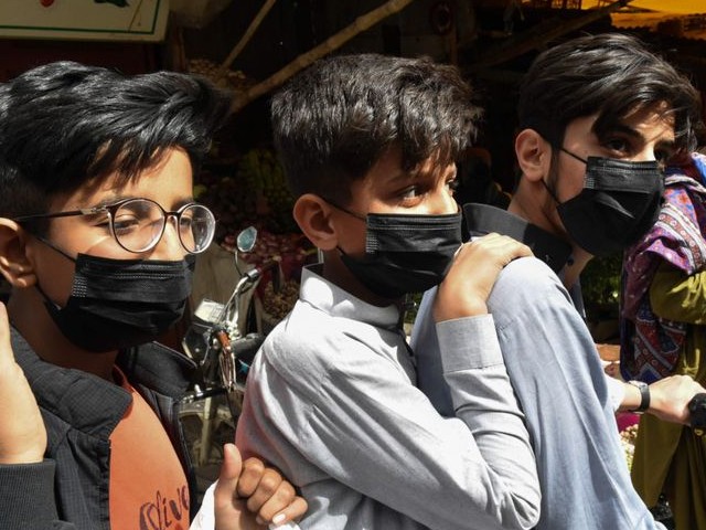 residents wear protective facemasks as a prevention measure against the covid 19 at a market in quetta photo afp file