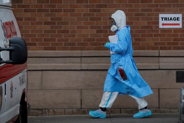 a healthcare worker is seen at the emergency center at maimonides medical center during the outbreak of the coronavirus disease covid 19 in the brooklyn borough of new york us april 14 2020 photo reuters