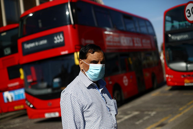 a man is seen wearing a protective face mask at a bus station as the spread of coronavirus disease covid 19 continues in london britain april 15 2020 photo reuters