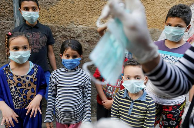 egyptian clown ahmed naser performs to entertain and help children to put on face masks as a preventive measure amid concerns about the spread of the coronavirus disease covid 19 in darb al ban district at islamic cairo egypt photo reuters file egyptian clown ahmed naser performs to entertain and help children to put on face masks as a preventive measure amid concerns about the spread of the coronavirus disease covid 19 in darb al ban district at islamic cairo egypt photo reuters file