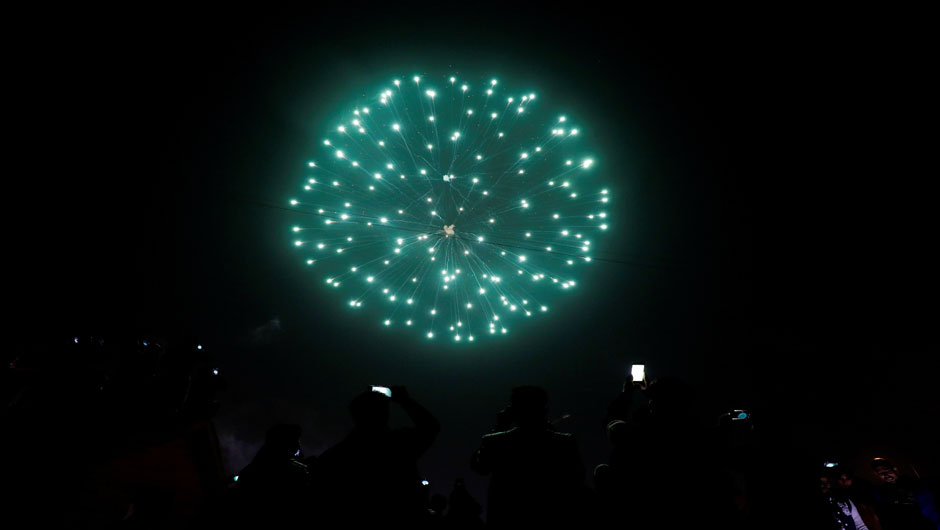 People record fireworks on mobile phones during a New Year celebrations at the Waterway in Cairo, Egypt January 1, 2020. PHOTO: REUTERS