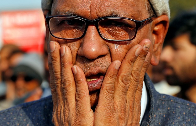 A demonstrator offers funeral prayers in absentia for the people who died after deadly clashes with police in Uttar Pradesh state, following days of violent protests across India against a new citizenship law, in New Delhi, India.