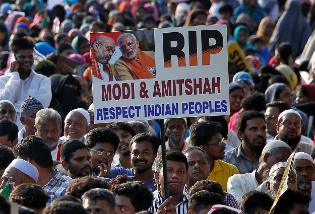 A boy displays a placard as he attends a protest rally against a new citizenship law, after Friday prayers in Chennai. PHOTO: REUTERS