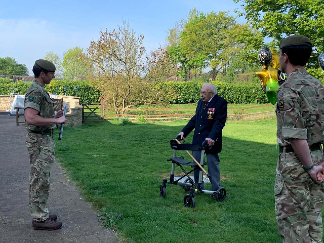 veteran capt tom moore talks to soldiers from 1st battalion the yorkshire regiment who formed a guard of honour for the veteran as he completed his fundraising walk for the health services in bedfordshire britain april 16 2020 photo reuters veteran capt tom moore talks to soldiers from 1st battalion the yorkshire regiment who formed a guard of honour for the veteran as he completed his fundraising walk for the health services in bedfordshire britain april 16 2020 photo reuters