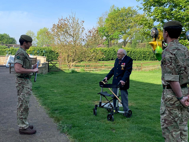 veteran capt tom moore talks to soldiers from 1st battalion the yorkshire regiment who formed a guard of honour for the veteran as he completed his fundraising walk for the health services in bedfordshire britain april 16 2020 photo reuters