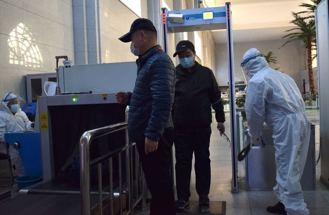 passengers wearing face masks go through security screening at the suifenhe railway station following an outbreak of the coronavirus disease covid 19 in suifenhe a city bordering russia in china 039 s heilongjiang province april 17 2020 photo reuters