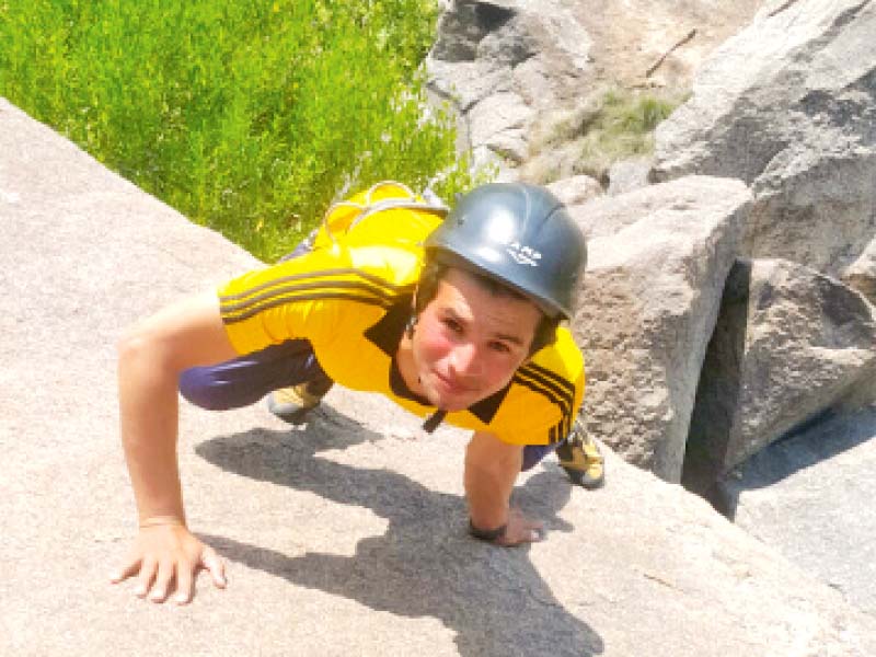 yasin can be seen climbing up rocks photo express
