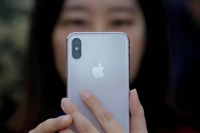 an attendee uses a new iphone x during a presentation for the media in beijing china october 31 2017 photo reuters