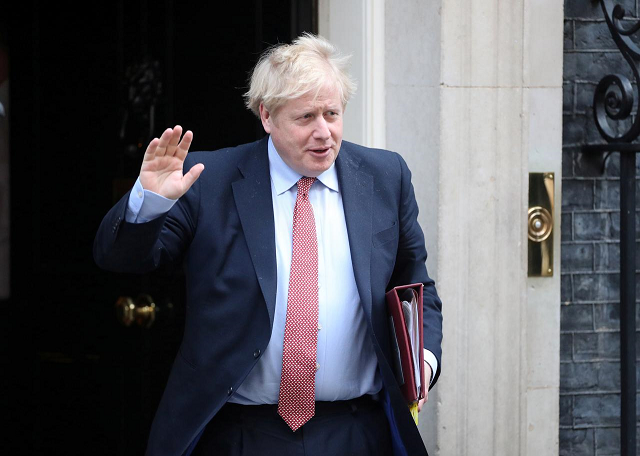 britain 039 s prime minister boris johnson waves as he leaves downing street as the spread of coronavirus disease covid 19 continues london britain march 25 2020 photo reuters