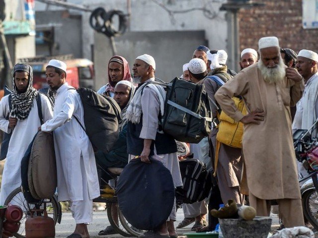 worshippers prepare for departure to the annual tablighi jamaat gathering in raiwind on the outskirts of lahore photo afp