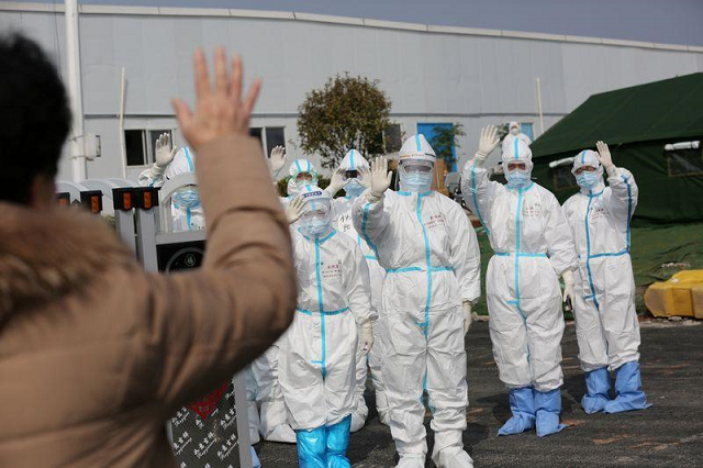 medical personnel in protective suits wave hands to a patient who is discharged from the leishenshan hospital after recovering from the novel coronavirus in wuhan the epicentre of the novel coronavirus outbreak in hubei province china march 1 2020 photo reuters