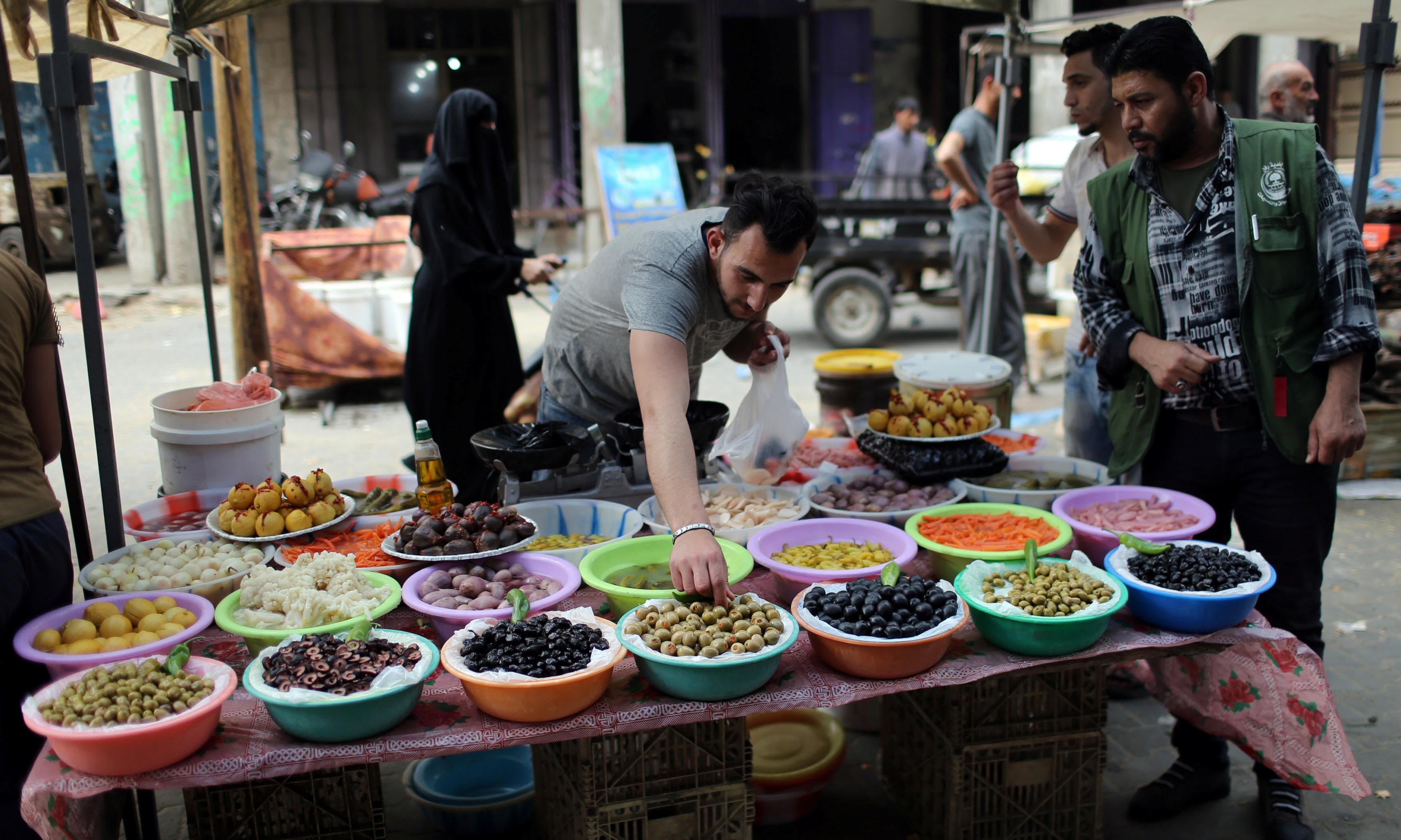 a palestinian man sells olives and pickles on the first day of the muslim holy month of ramadan in the southern gaza strip photo reuters