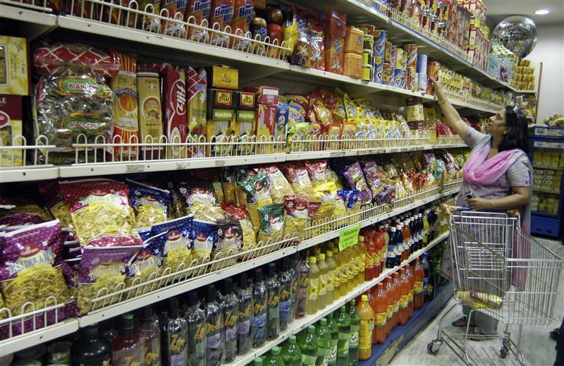 a woman shops in a grocery store photo reuters