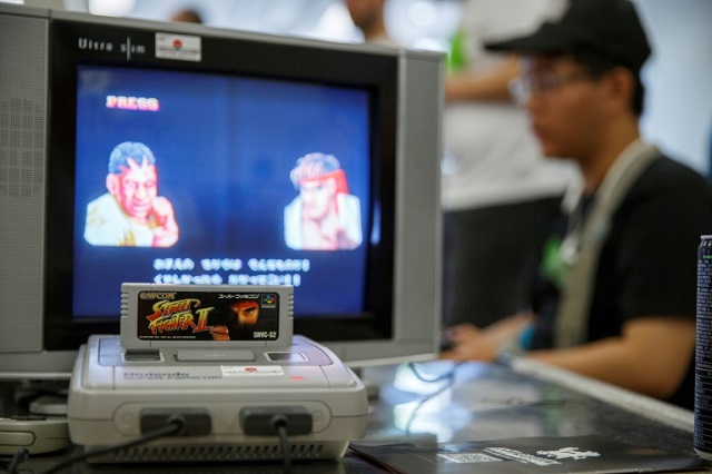 a group of japanese retro gaming fans is offering 100 super nintendo consoles similar to the one pictured here to cooped up kids photo afp