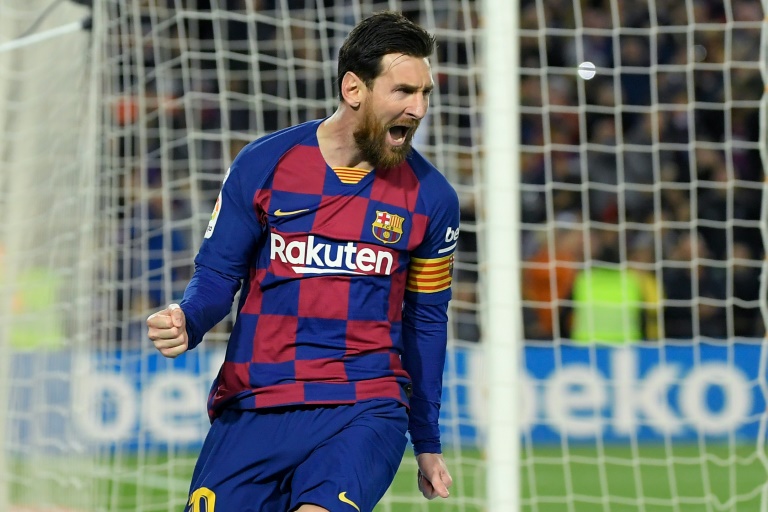 lionel messi 039 s barcelona lead the league with 11 rounds of the season to play photo afp