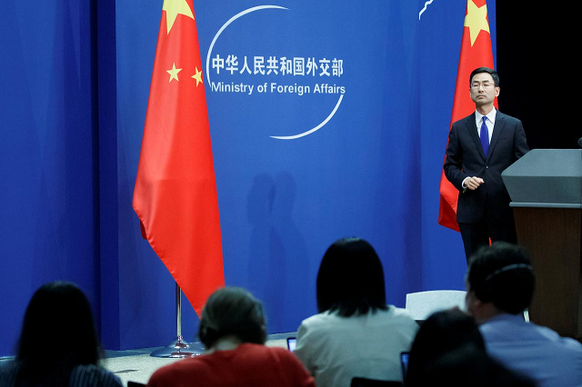 chinese foreign ministry spokesperson geng shuang and journalists attend the daily press briefing of the foreign ministry in beijing china march 18 2020 photo reuters