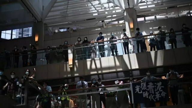 pro democracy supporters gather at a shopping mall during a lunchtime rally in hong kong photo afp