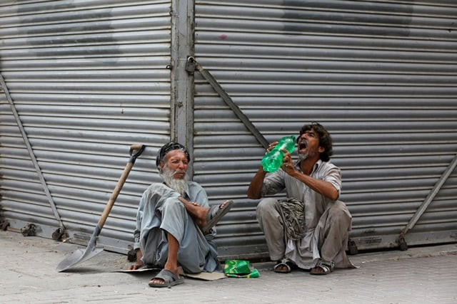 daily wage laborers wait for work as they sit outside closed shops during lockdown amid the outbreak of coronavirus disease at a market in karachi pakistan april 14 2020 reuters daily wage laborers wait for work as they sit outside closed shops during lockdown amid the outbreak of coronavirus disease at a market in karachi pakistan april 14 2020 reuters