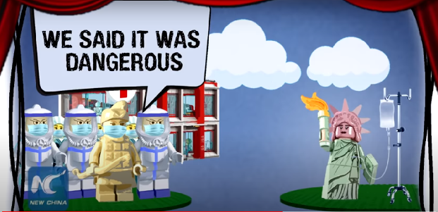 in the animation red curtains open to reveal a stage featuring lego like figures in the form of a terracotta warrior wearing a face mask and the statue of liberty screengrab