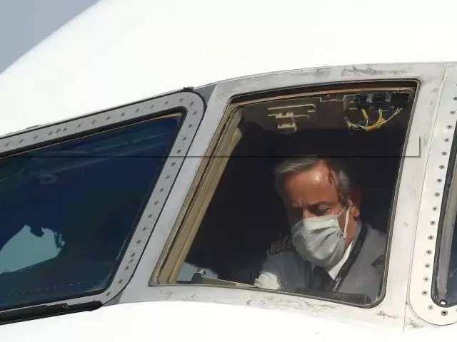a pilot wearing a protective mask is seen in a cargo aircraft chartered by the un world food programme with medical supplies to help developing countries hit by the coronavirus disease covid 19 outbreak at liege airport belgium photo reuters file a pilot wearing a protective mask is seen in a cargo aircraft chartered by the un world food programme with medical supplies to help developing countries hit by the coronavirus disease covid 19 outbreak at liege airport belgium photo reuters file