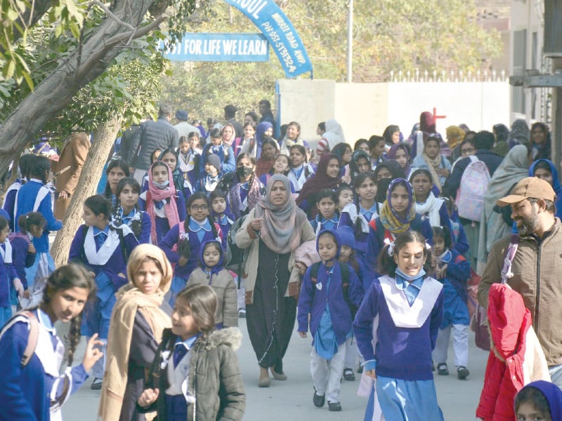 students accompanied by their parents make their way home after the first day of school following the winter break in rawalpindi the winter vacation in punjab which started on december 23 2024 concluded on january 10 2025 with schools reopening on january 13 2025 photo online