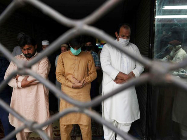 muslim devotees offer friday prayers at a mosque during a government imposed nationwide lockdown as a preventive measure against covid 19 in lahore on april 17 2020 photo afp