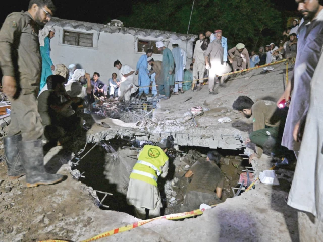 rescue workers and residents search for victims in the debris of a collapsed house after a cloudburst in dolari village of swabi district photo afp rescue workers and residents search for victims in the debris of a collapsed house after a cloudburst in dolari village of swabi district photo afp