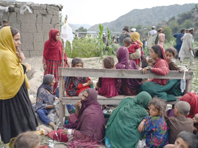 afghan injured women and girls sit as they receive medical treatment at a field in the mazar dara village of nurgal a district of kunar province afghanistan photo afp afghan injured women and girls sit as they receive medical treatment at a field in the mazar dara village of nurgal a district of kunar province afghanistan photo afp