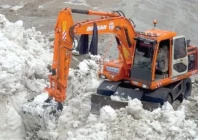 a snow clearing vehicle removes icy remnants of a glacier from the kaghan road in balakot as the route opens after months of closure following heavy snowfall in winter photo express