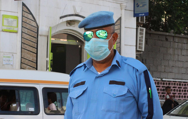 a police officer wearing a protective face mask is pictured on a street during a curfew amid concerns about the spread of the coronavirus disease covid 19 in aden yemen april 30 2020 photo reuters