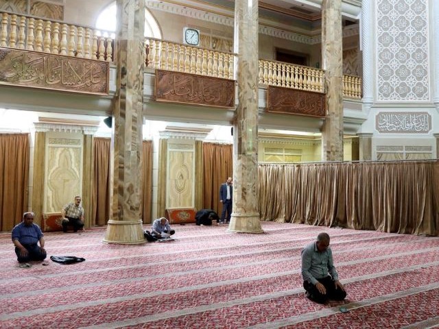 iranian worshippers pray as they keep social distancing at a mosque following the outbreak of the coronavirus disease covid 19 in tehran iran photo reuters file