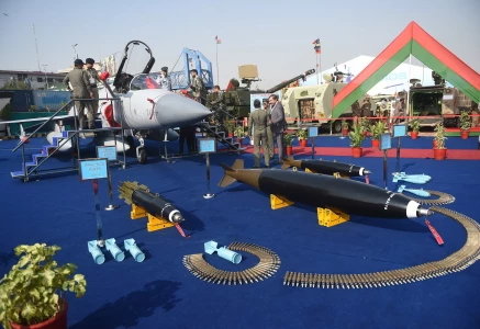 military officials gather around a jf 17 thunder aircraft and ammunition at the expo centre in karachi photo afp