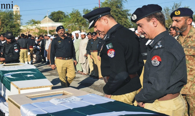 k p ig moazzam jah ansari files past the coffins of police officials martyred in a gun attack in lakki marwat on november 16 2022 photo nni file k p ig moazzam jah ansari files past the coffins of police officials martyred in a gun attack in lakki marwat on november 16 2022 photo nni file