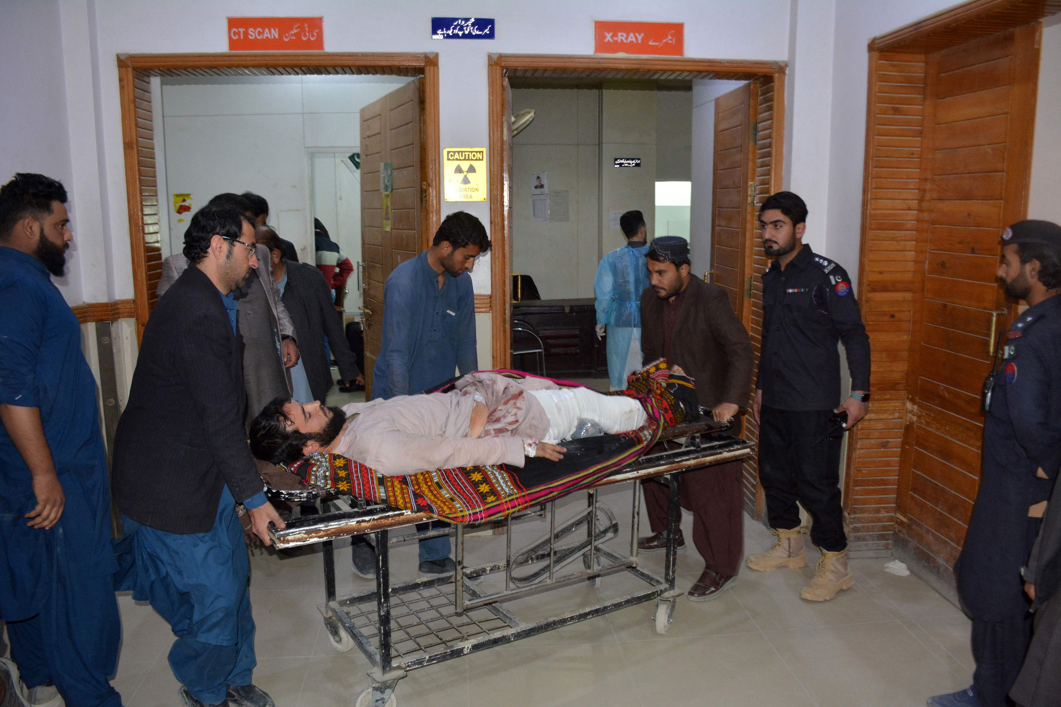 relatives of an injured person shift him to a hospital in quetta photo afp