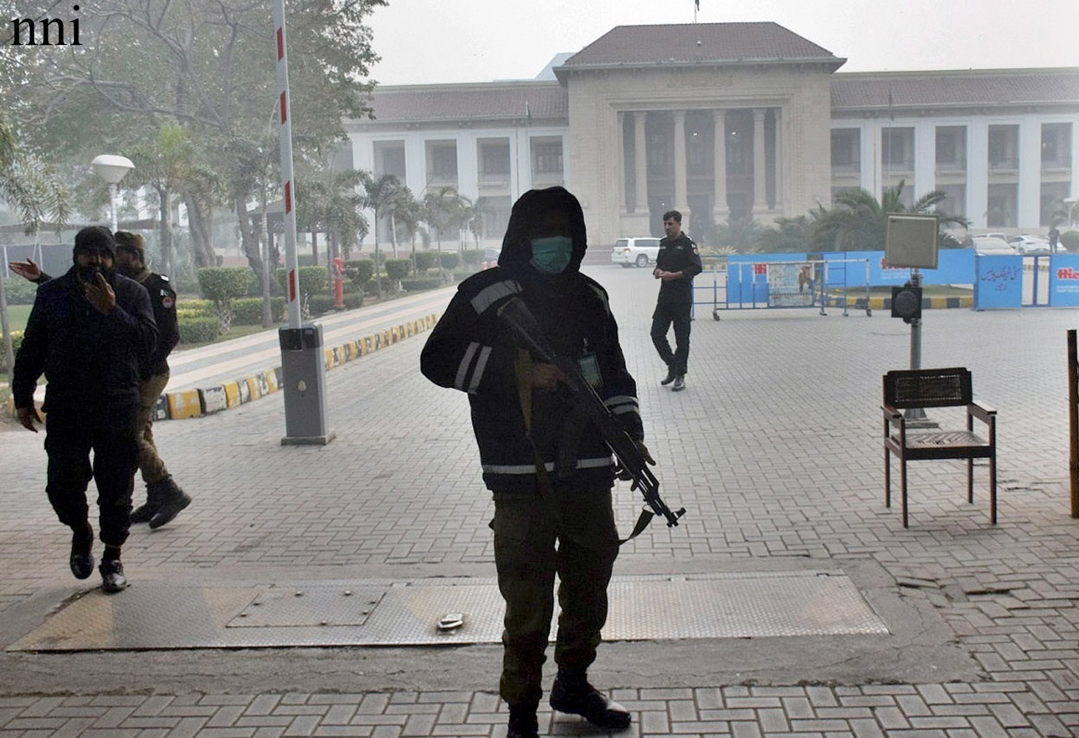 police guard the punjab assembly building on a foggy day in lahore photo nni