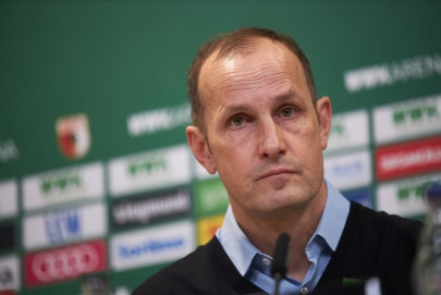 toothpaste trip sidelines augsburg coach from bundesliga restart