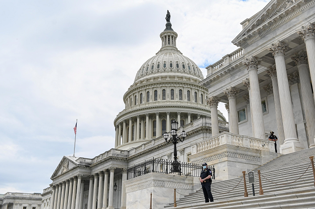 police officers wearing face masks guard the u s capitol building in washington us may 14 2020 photo reuters