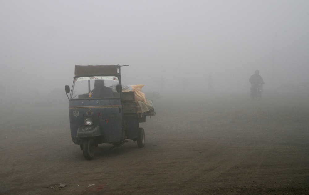 a man drives his rickshaw in heavy smog in lahore photo reuters