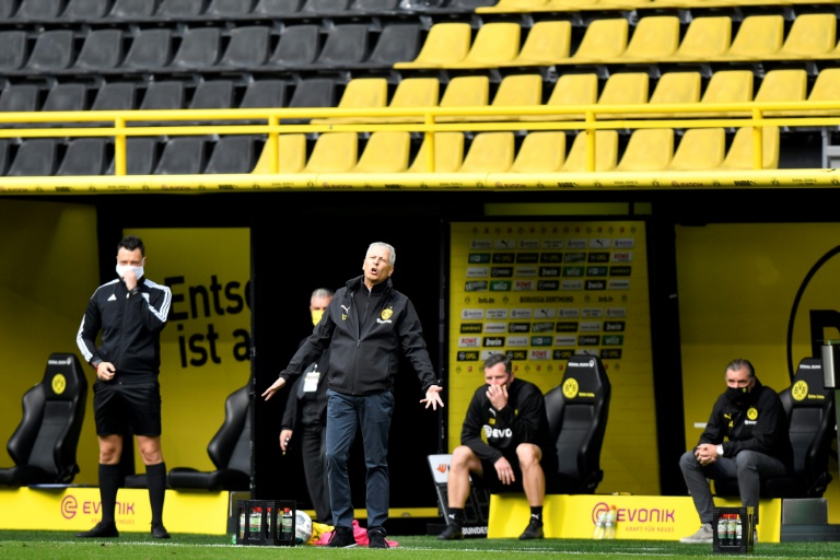 matches were played without fans while goal celebrations were banned and benches observed social distancing photo afp