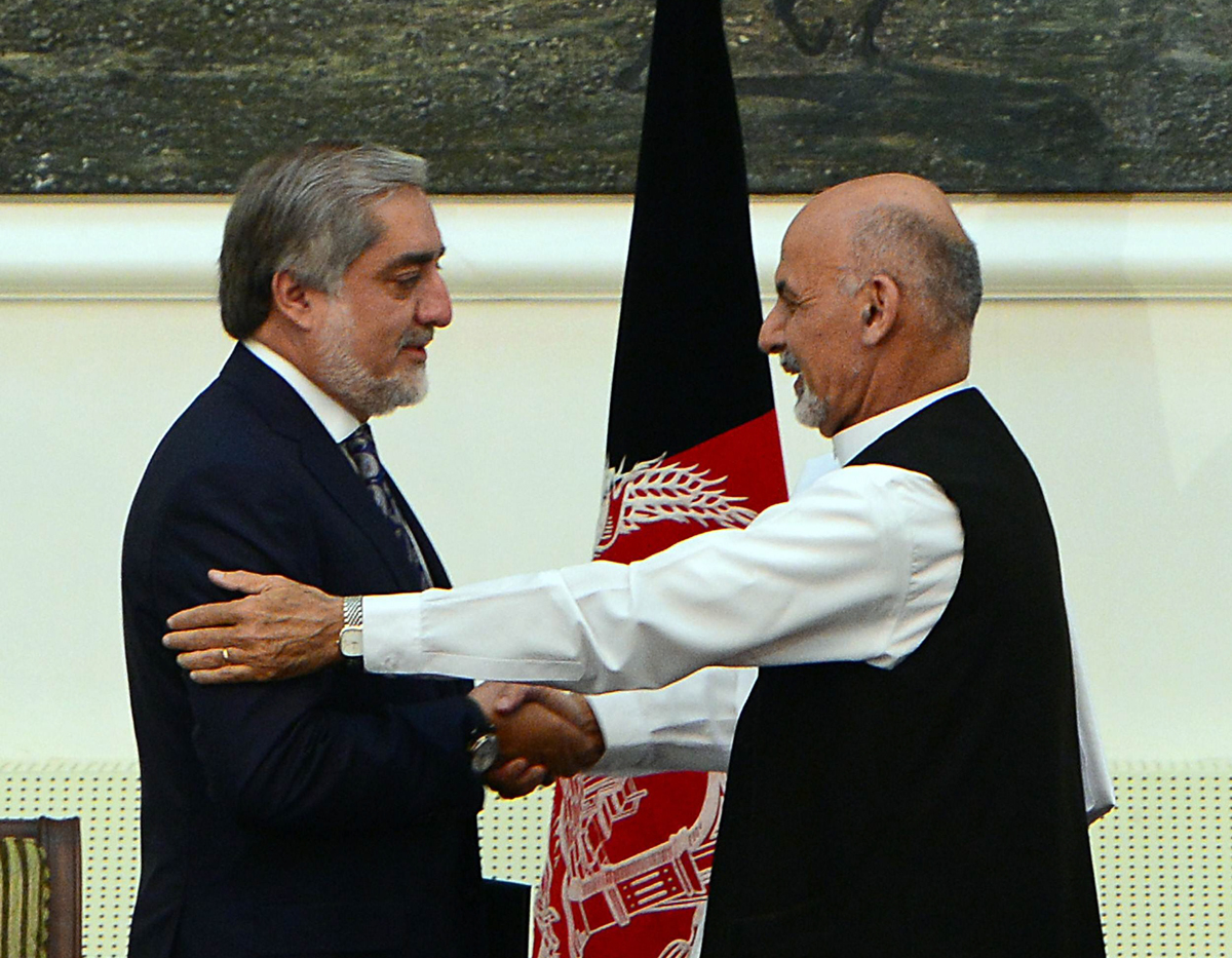 the new arrangement is in line with the power sharing deal brokered by the united states and gives both ghani and abdullah an equal share in the cabinet photo afp