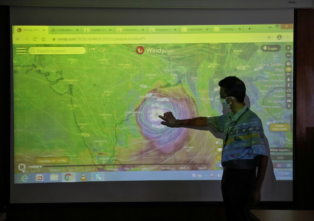 a scientist at india meteorological department earth system science organisation points to a section of the screen showing the position of the cyclone amphan to media people inside his office in kolkata photo reuters a scientist at india meteorological department earth system science organisation points to a section of the screen showing the position of the cyclone amphan to media people inside his office in kolkata photo reuters