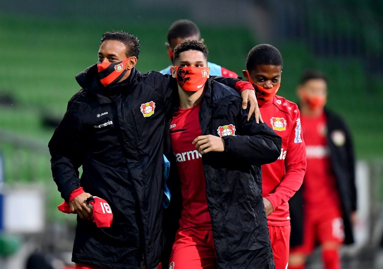 the players are being regularly tested for the virus and substitutes wore face masks while sitting spaced out on the benches photo afp