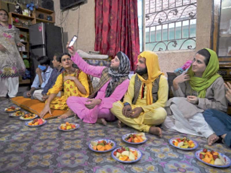 members of the transgender community gather to break their fast at a house in rawalpindi photo afp