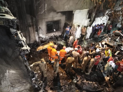 in pictures pia plane crashes on homes in karachi