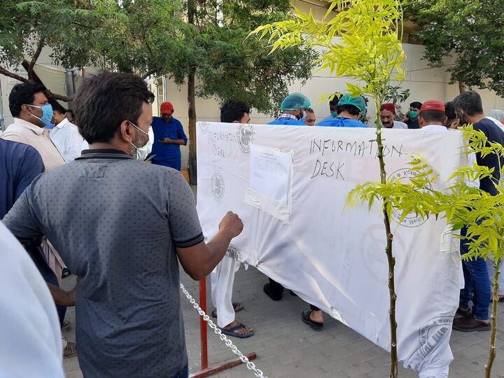 a man looks at a list of the deceased and injured brought in to jpmc from the crash site posted at an information desk outside the hospital many of the bodies remain unidentified photo express