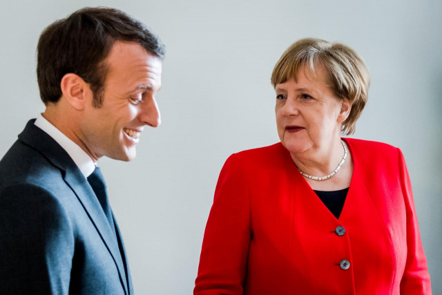 a reuters file photo of merkel and macron in a deep conversation a reuters file photo of merkel and macron in a deep conversation