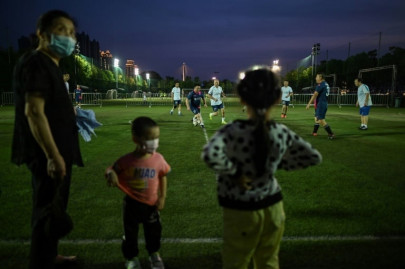 football makes gleeful return to wuhan