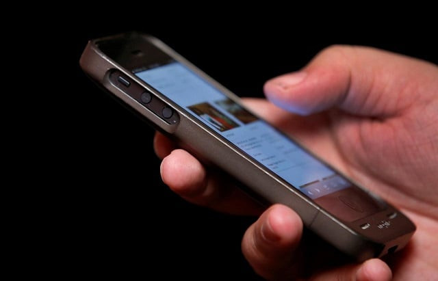 a man uses a smartphone in new york city in this picture taken november 6 2013 photo reuters a man uses a smartphone in new york city in this picture taken november 6 2013 photo reuters