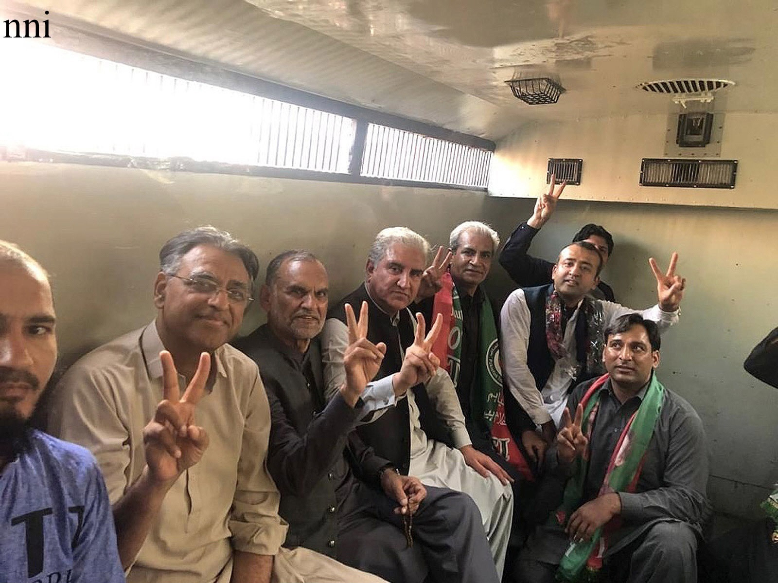 pti leaders shah mahmood qureshi asad umar and others sit in a police van following their arrest in lahore photo nni