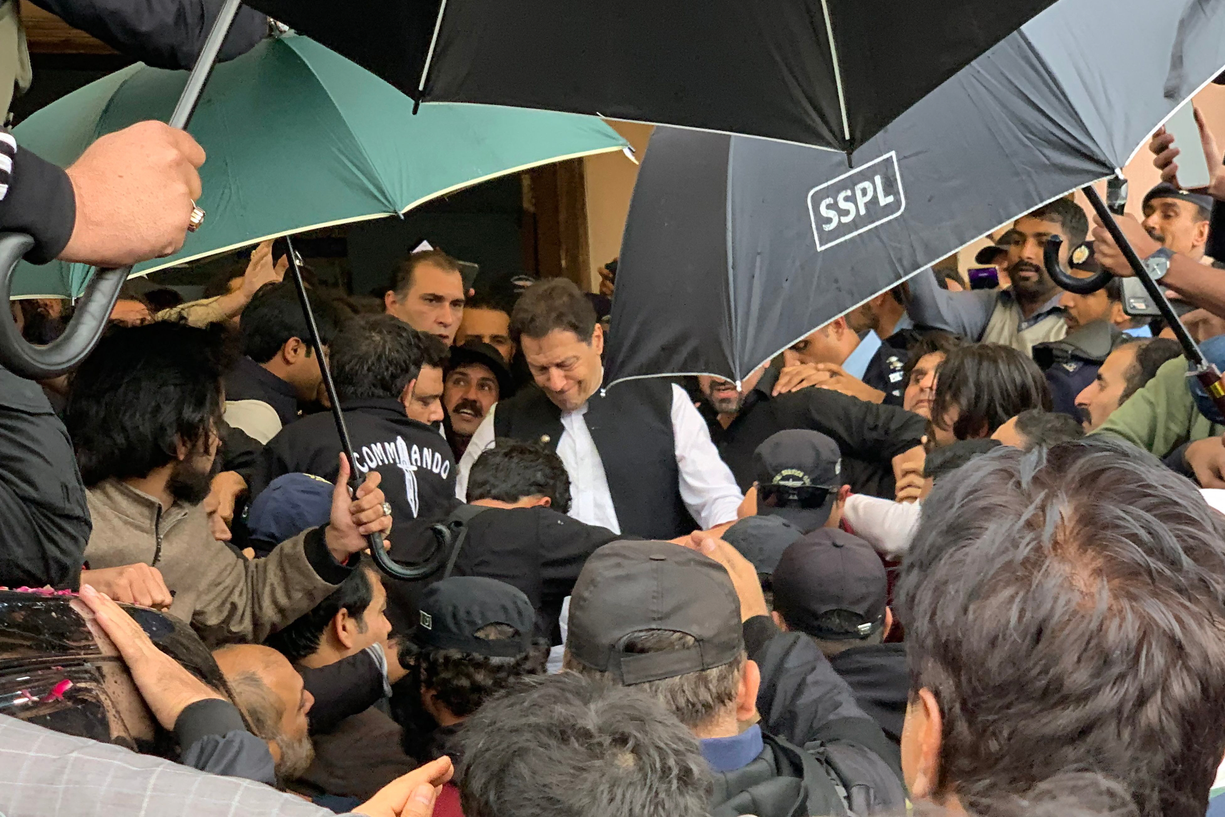 pti chairman imran khan leaves after appearing before a court in islamabad photo afp